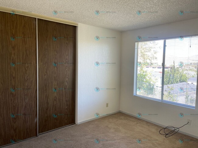 Building Photo - This delightful 2-bedroom, 1-bathroom condo perched upstairs offers an irresistible opportunity y...