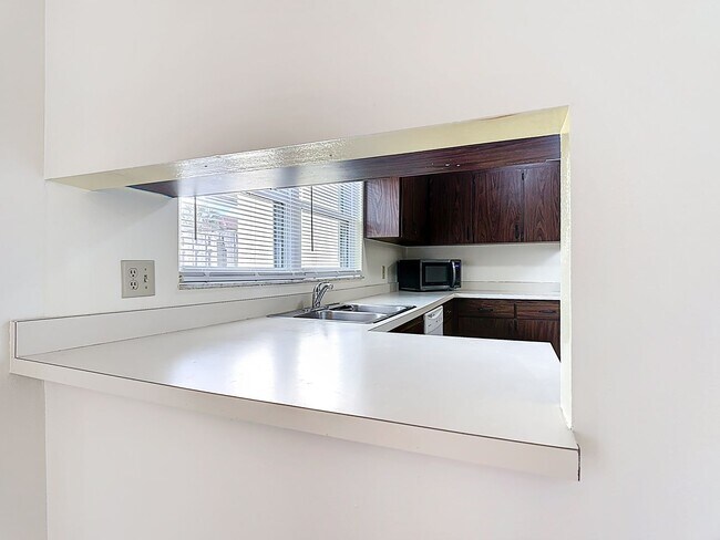 Building Photo - Spanish-Style 3 Bedroom, 2.5 Bath Mediterranean Rooftop Townhouse – Basic Cable & Wi-Fi Included!