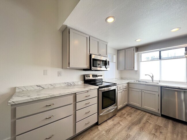 Building Photo - Beautifully Remodeled 2-Bedroom, 2-Bathroom Townhome with Single-Car Garage