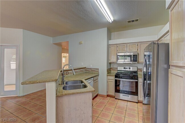 Building Photo - 5415 W Harmon Ave