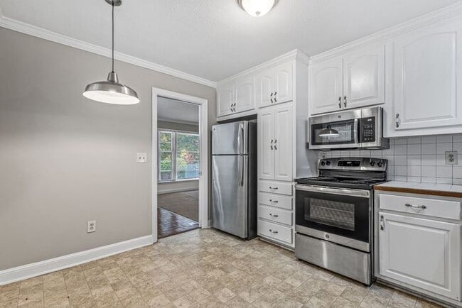 Building Photo - McLeansville - Minutes from Elon & Greensboro! Brick Duplex on a few Acres, Den, SS Appliances, F...