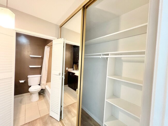 Building Photo - Contemporary 2 Bed Condo with 2 Garage Parking Spaces, Community Pool, and 3 Private Balconies