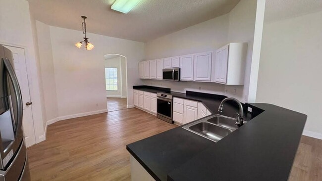 Building Photo - "Stunning 4-Bedroom Lake View Home in Oviedo – Spacious 2,132 Sq Ft Retreat!"