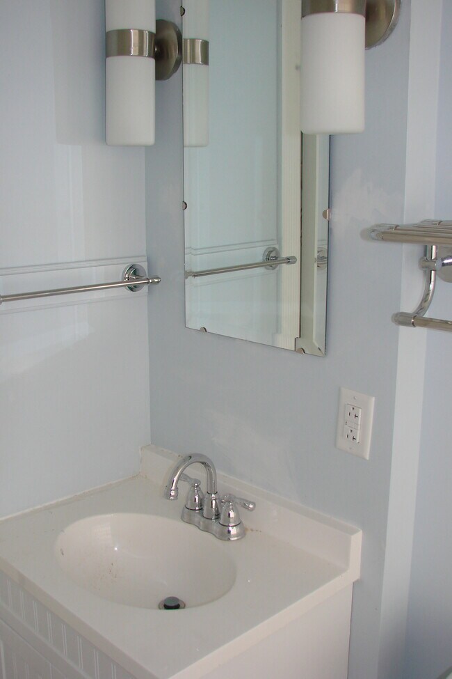 Bathroom vanity, irror and towel racks - 713 Orchard St