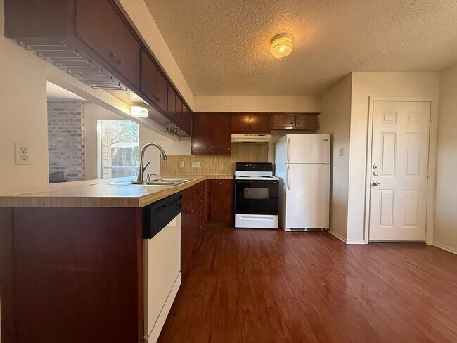 Building Photo - Wood Properties1 (8102 Dunn St)