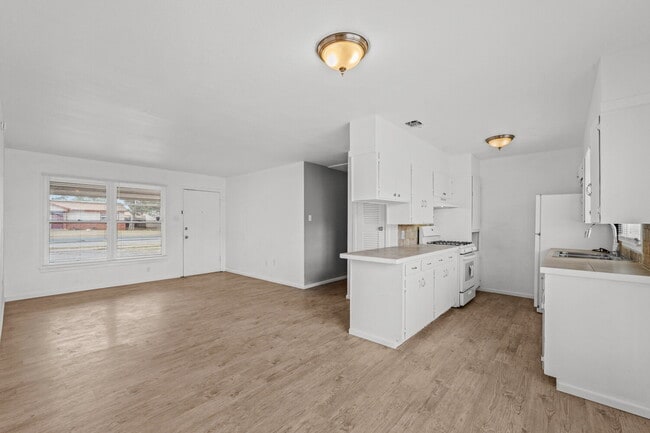 Building Photo - Updated Home with Gorgeous Floors & Large Backyard