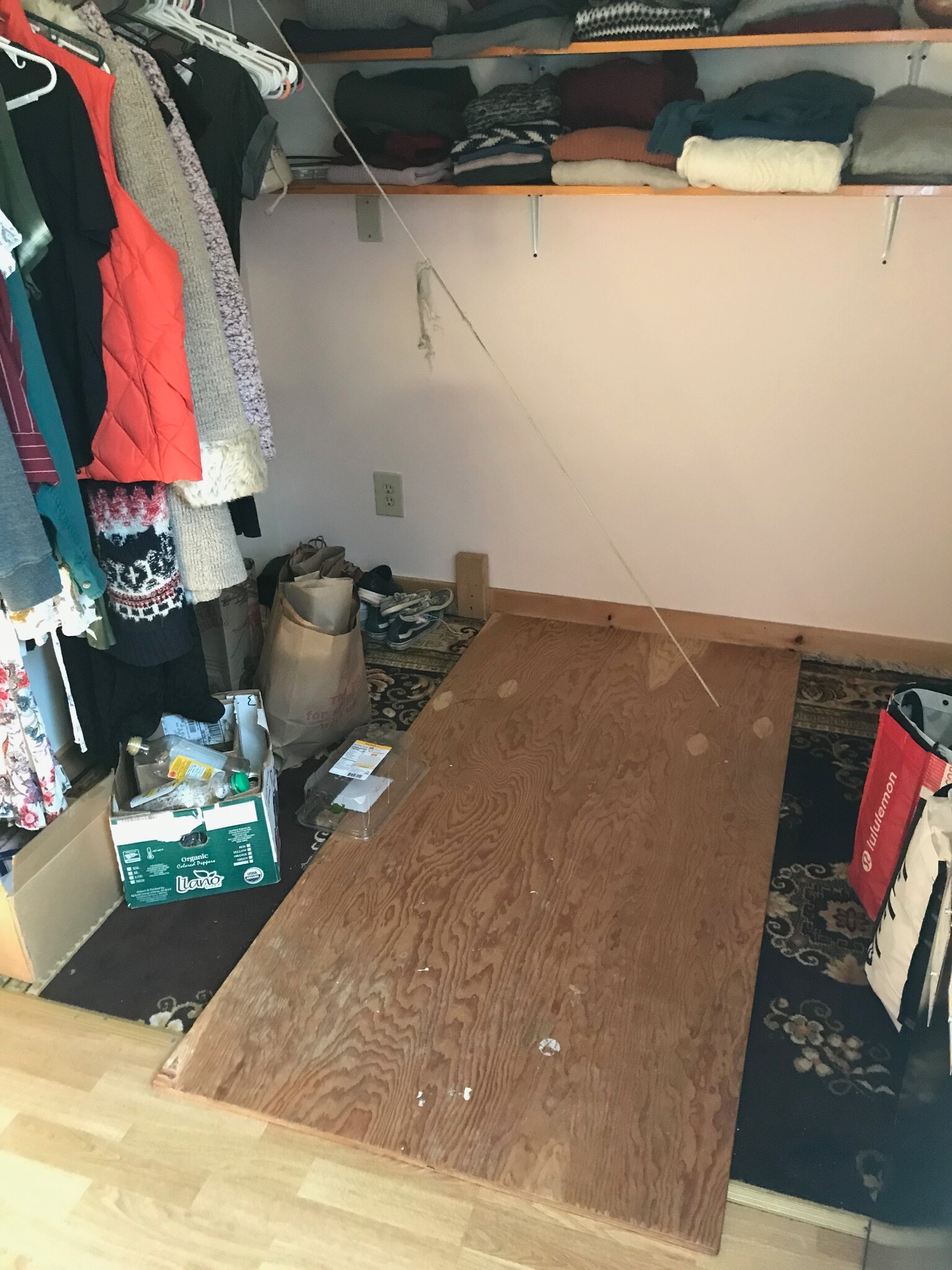 Clothes hanging space & trap door closed - 657 Maple Hill Rd