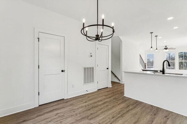 Building Photo - High-End 2BR Townhome | Rooftop Terrace + 2-Car Garage | 24-Unit Community