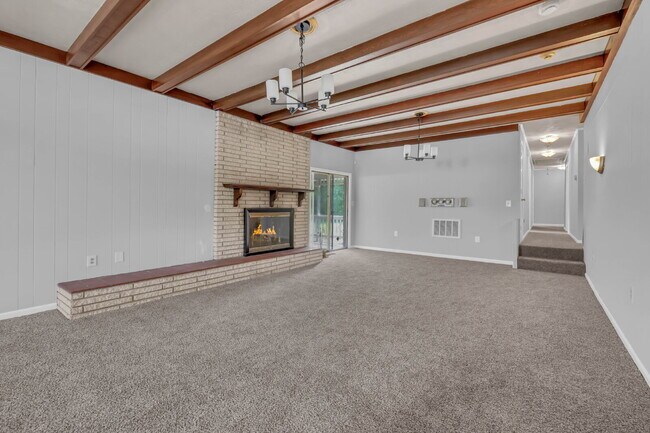 Building Photo - spacious 4-bedroom, 2.5-bath home featuring a 2-car garage and fresh updates throughout.