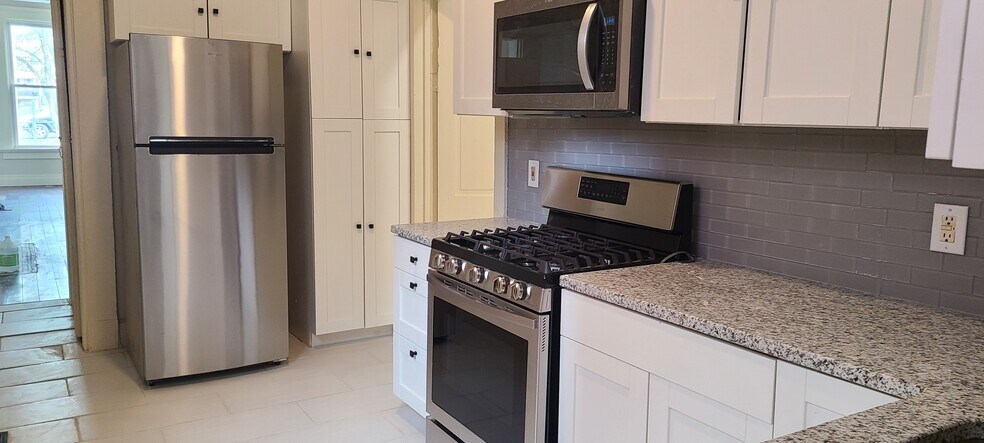 Kitchen with plenty of Storage - 208 E 9th St