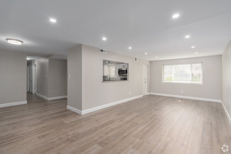 3BR, 2BA - 1,522SF - Living Room - Olympic Gardens
