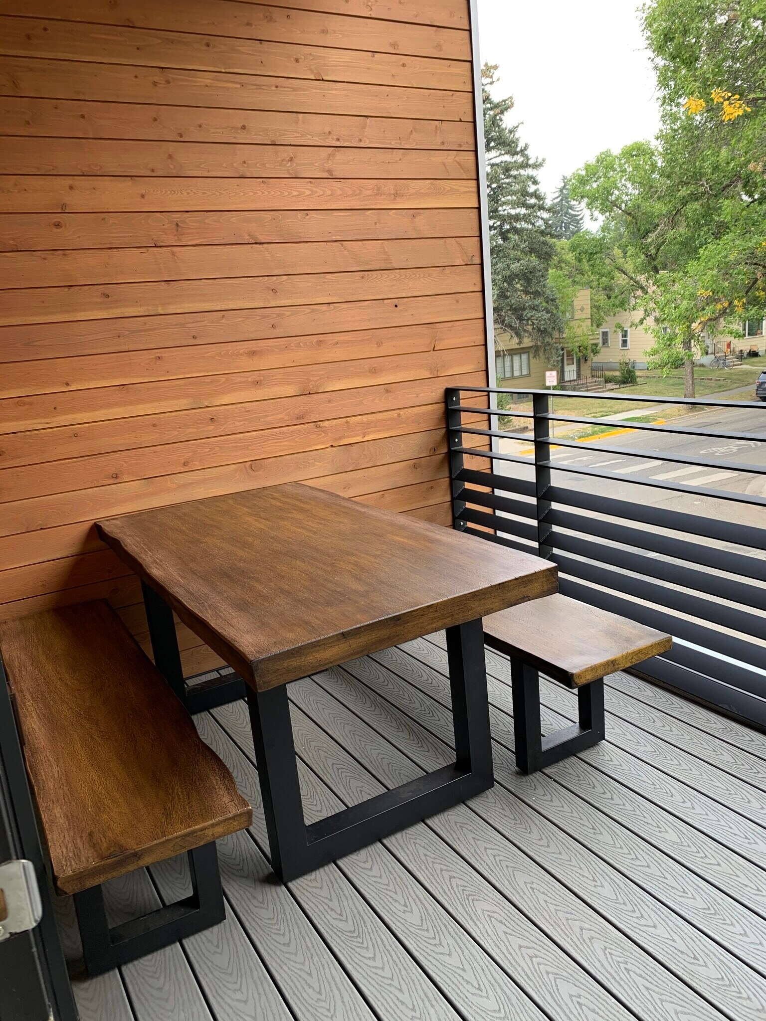 cement table on deck - 718 W Babcock St