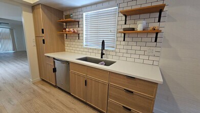 Building Photo - This is a must-see chic and updated townho...