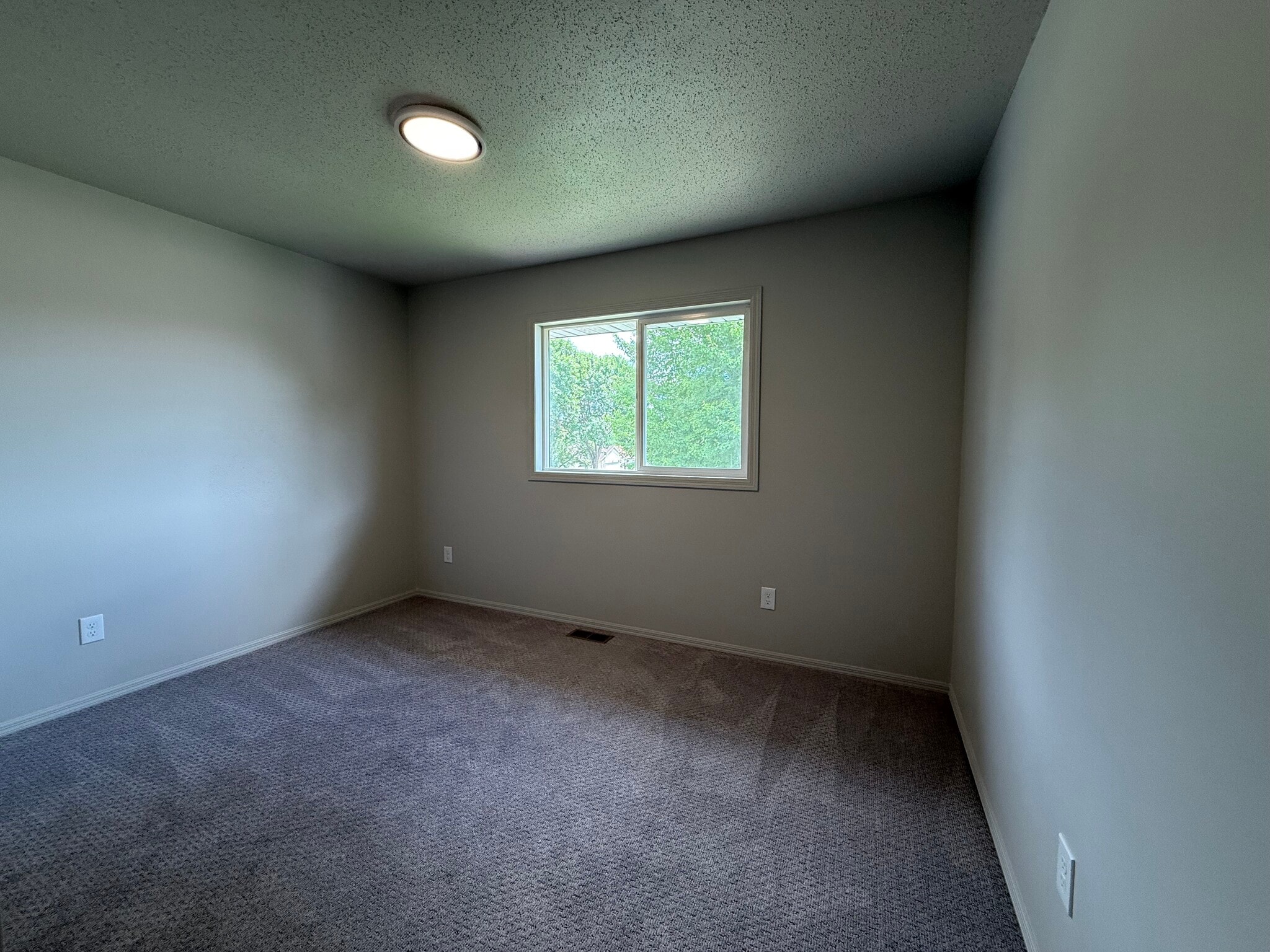 Upstairs bedroom #1 with new carpet and paint - 2005 S Gordon Dr