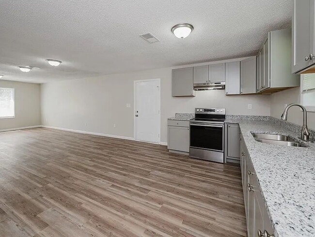 Building Photo - "Experience Spacious Living in Talladega: ...