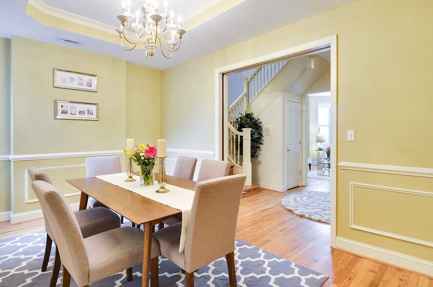 Dining room with chandelier and pocket doors - 3538 10th St NW