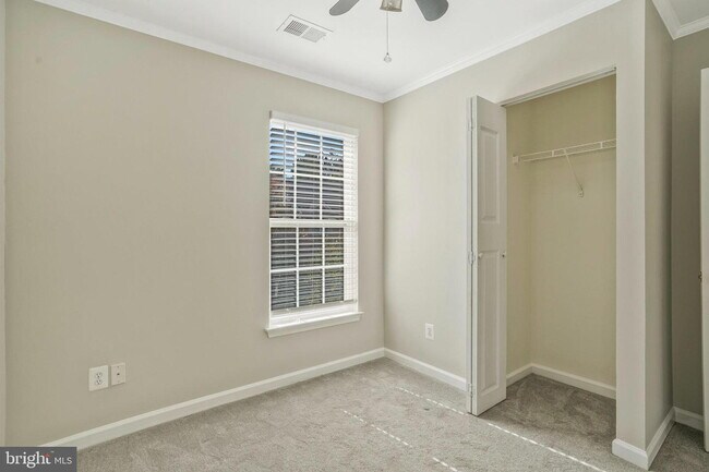 Building Photo - This beautifully maintained brick-front, three-level townhome is located in a highly sought-after...