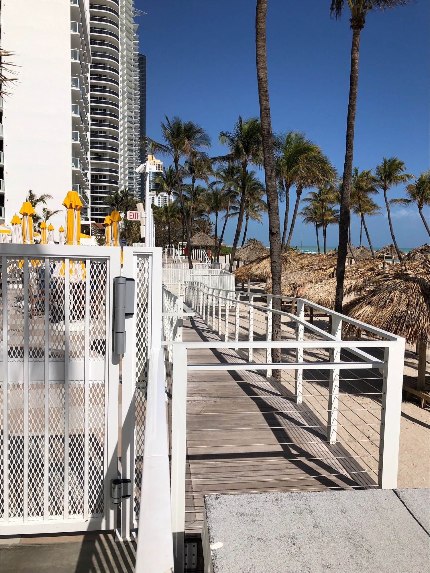 Easy beach access with the wheelchair ramp to the beach. - 16699 Collins Ave