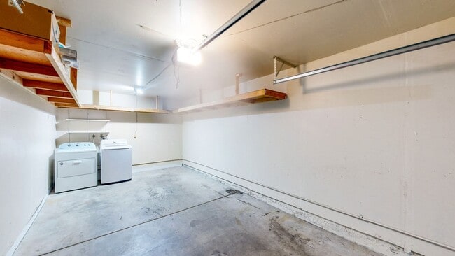 Building Photo - Cozy 1 bedroom 1 bath end unit condo with 1 car garage and private patio located next to Peterson...