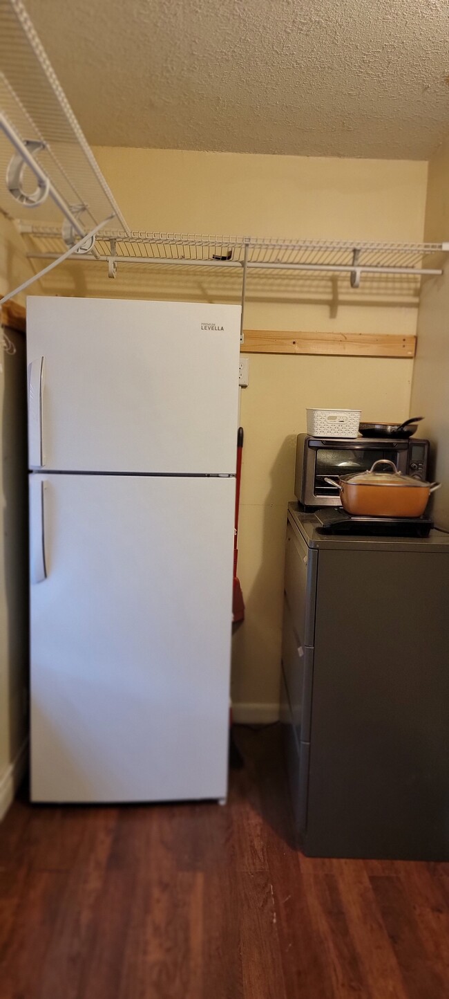 Full size newer refrigerator. Toaster oven. Induction burner cooktop. - 9070 Kimberly Blvd