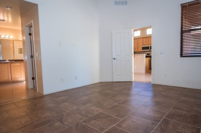 Building Photo - Gorgeous 3 Bedroom 2 Bathroom Home with Tile Throughout! Central A/C, 2 Car Garage!