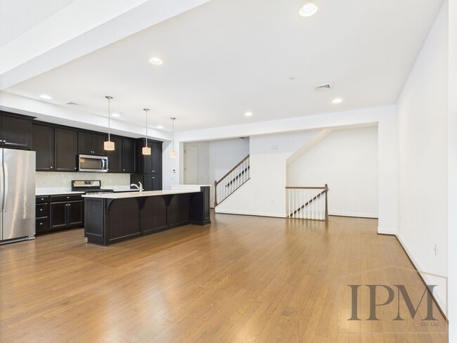 Building Photo - 2-bedroom 2.5 bath Luxury Townhome located...