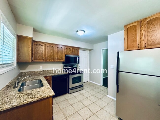 Building Photo - Attractive Prairie Village Ranch w/ FRESH PAINT, Wood Floors, Granite Counters and a Fenced Yard!