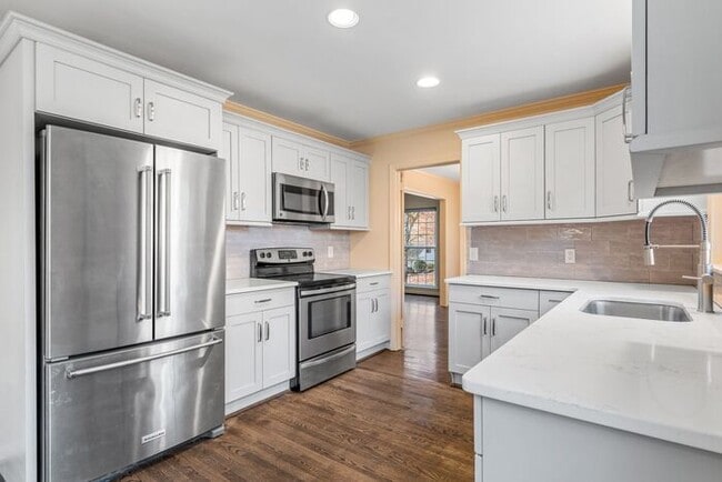 Building Photo - NW, Updated, Wood Floors, SS Appl., Den, Dining Roon, Sun Room, Finished Basement, Fenced!