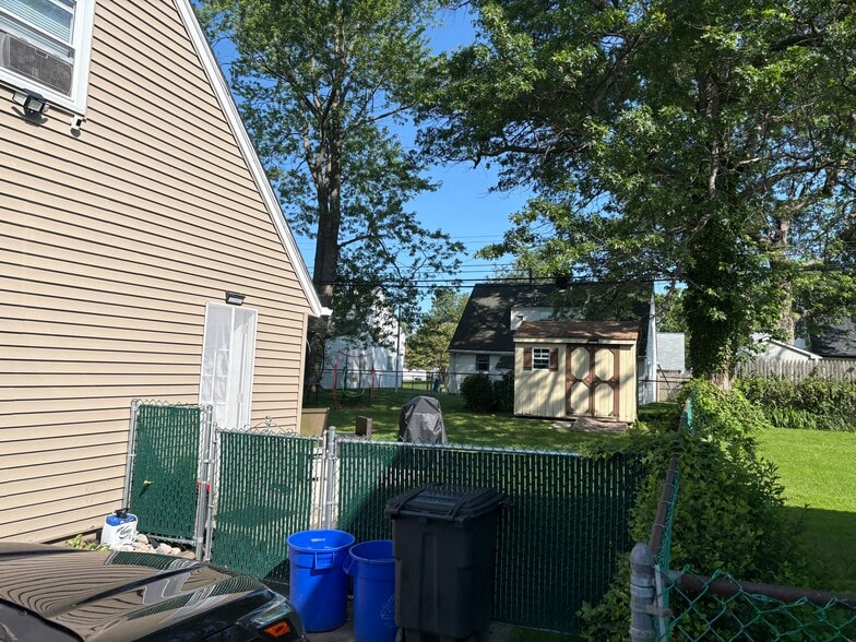 Fenced in backyard with shed - 2609 Armstrong Ave