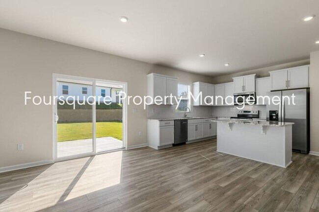 Building Photo - 4 Bedroom Home with 2nd Floor Loft- Kitchen Island & 2-Car Garage – Convenient Raleigh Location