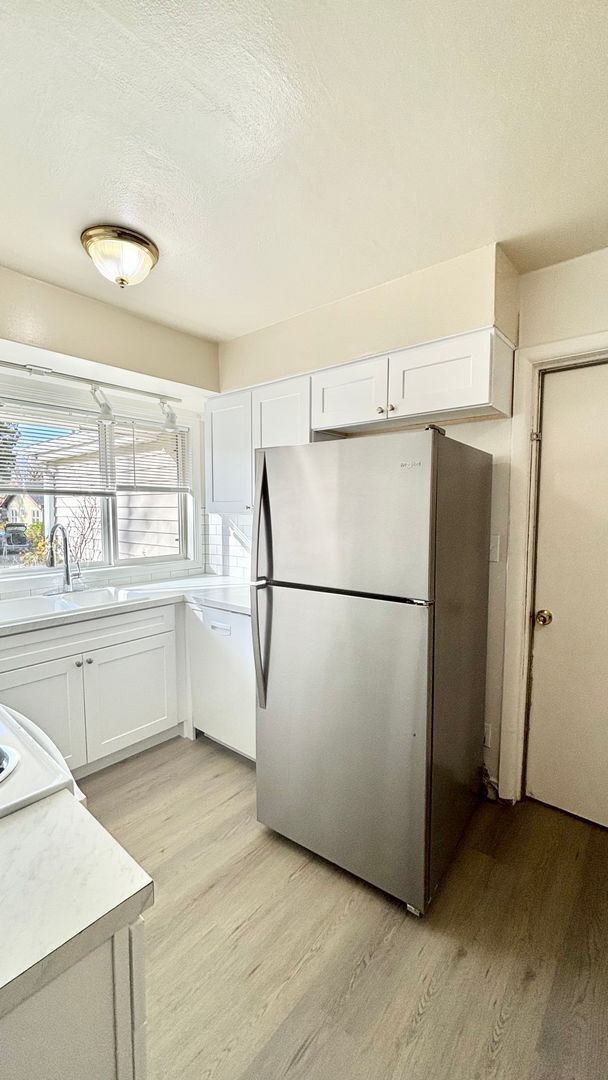 Building Photo - Recently Renovated House With Fenced Back Yard, Attached Garage, and Basement