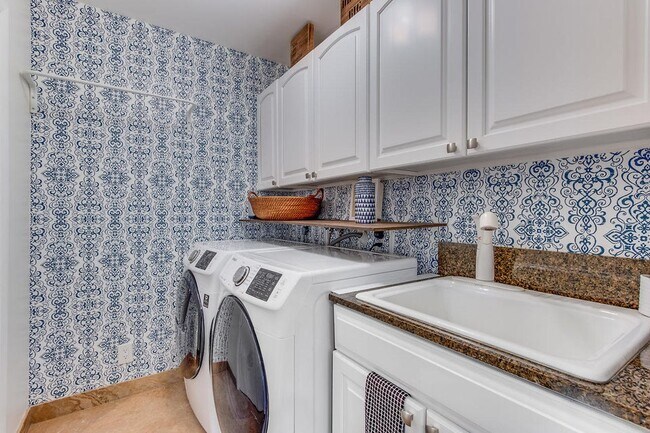 Interior Laundry with sink and full wall closet for storage - 2535 NW 41st St
