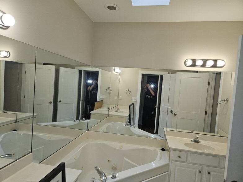 doulble sinks with Jacuzzi with sky light above - 6553 Cherry Tree Ln