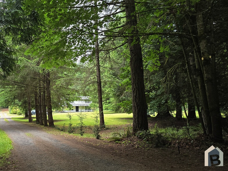 Beautiful entrance surrounded by mature evergreens - 20981 Port Gamble Rd NE
