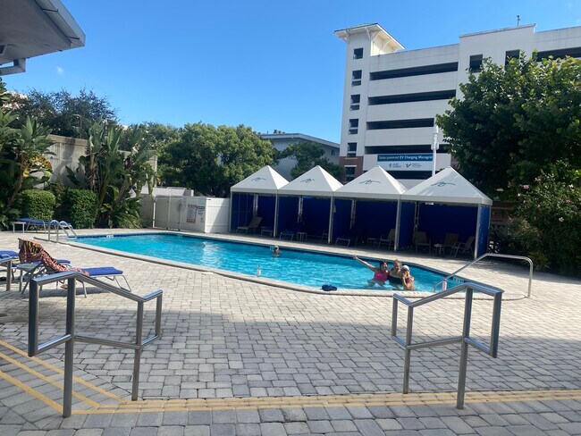 Pool area with gazebos, grill, and rinse off shower. - 470 3rd St S
