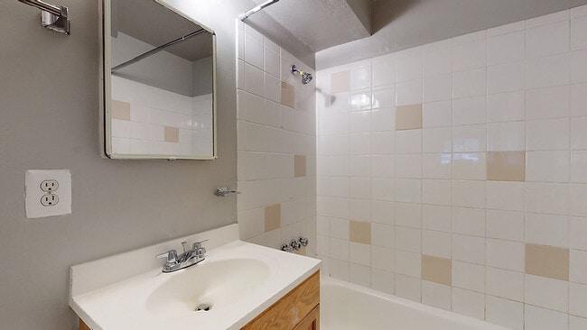 Experience elegance in our contemporary bathroom, designed for relaxation. - Flats at Sloan's Lake West