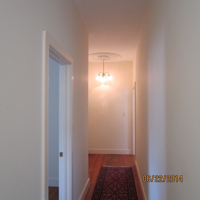 Hallway with historic celing medallion - 120 W Main St