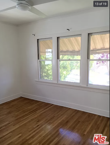 Front bedroom with windows on 2 sides and a walk-in closet - 1337 S Cloverdale Ave