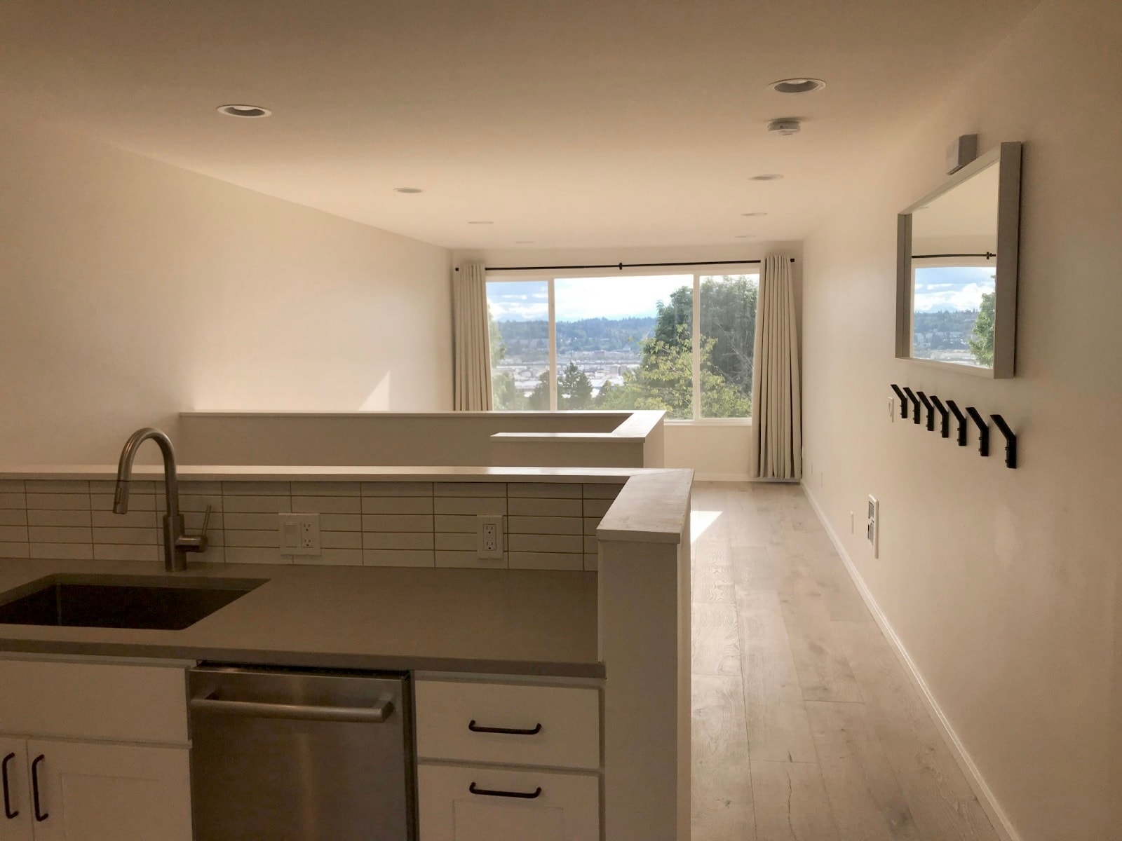 Open concept living space awash with natural light - 4253 Palatine Ave N