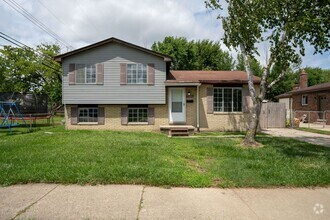 Building Photo - Must see FOUR bedroom Trilevel home