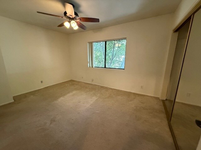 Rear bedroom with ceiling fan/light & private bathroom - 10481 Riverside Dr