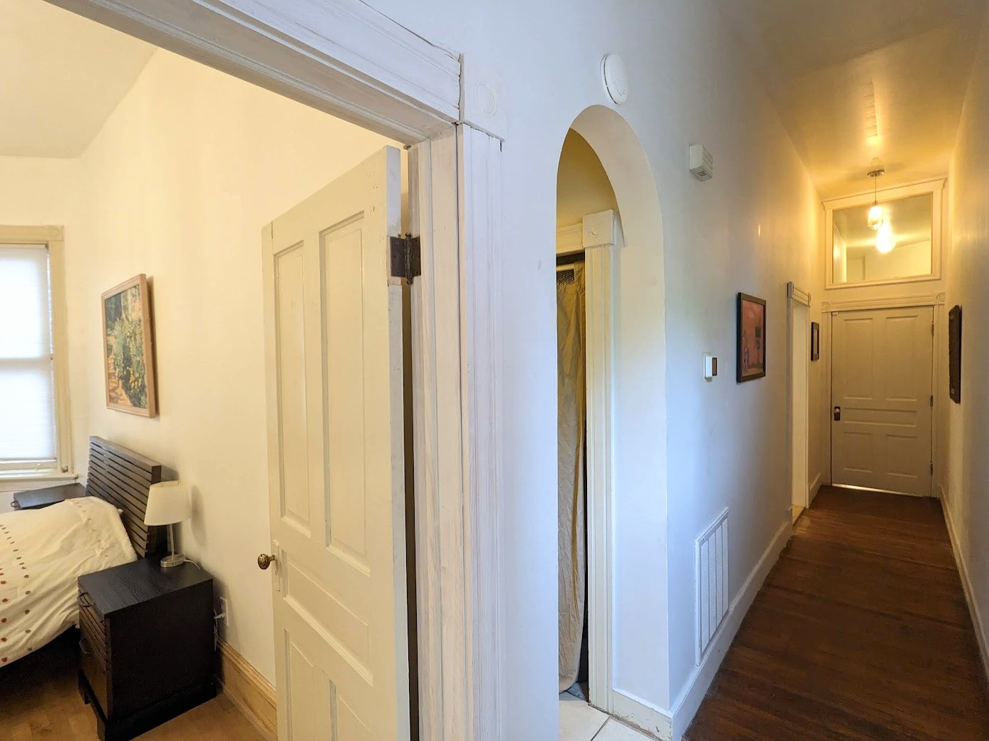 The bathroom is between the two bedrooms (through the arch). - 1816 W Grace St