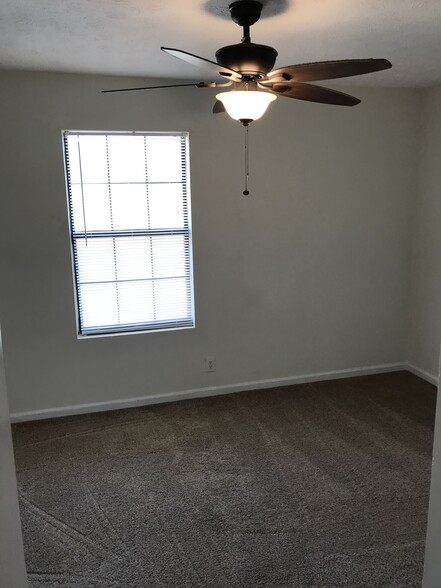 Upstair bedroom, both have ceiling fans and large closets. - 735 Park Cir