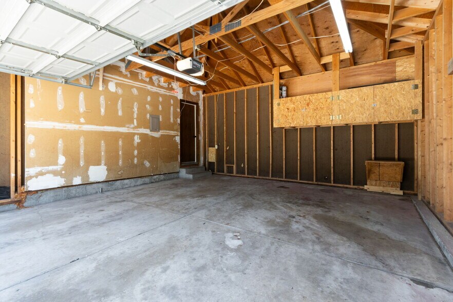 Attached, oversized 2-car garage with storage. - 1956 Promenade Way