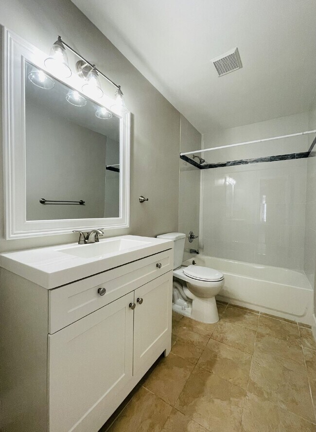 Building Photo - Updated 2-bedroom waterfront duplex with walk-in closets, enclosed Florida room, and canal views ...