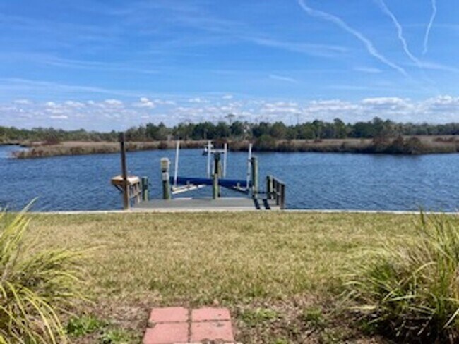 Building Photo - Waterfront condo with community pool!