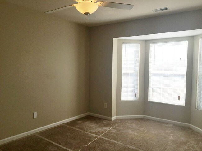 Building Photo - Gas Fireplace! Fenced-in Patio! Storage Space!