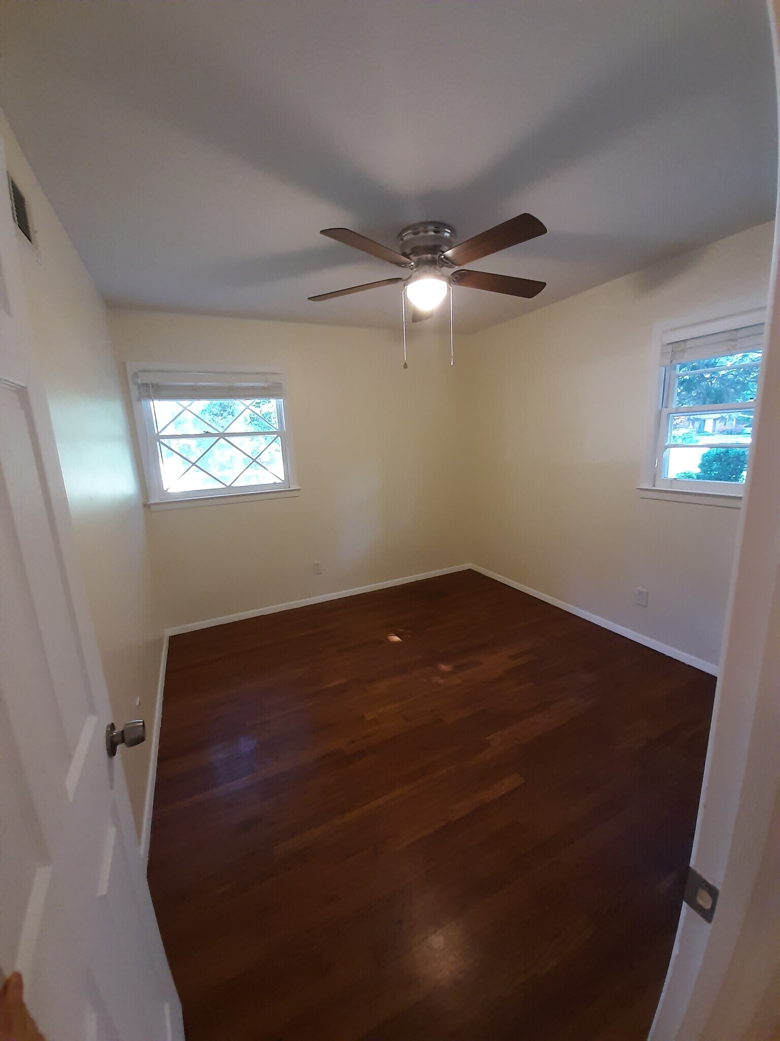 The 2nd bedroom at the end of the hallway to the left faces the street. - 2955 Fantasy Ln