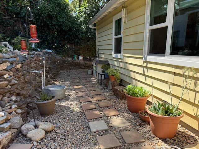 Stone and pavers walkway to side gate of backyard - 125 Pleasant Ave