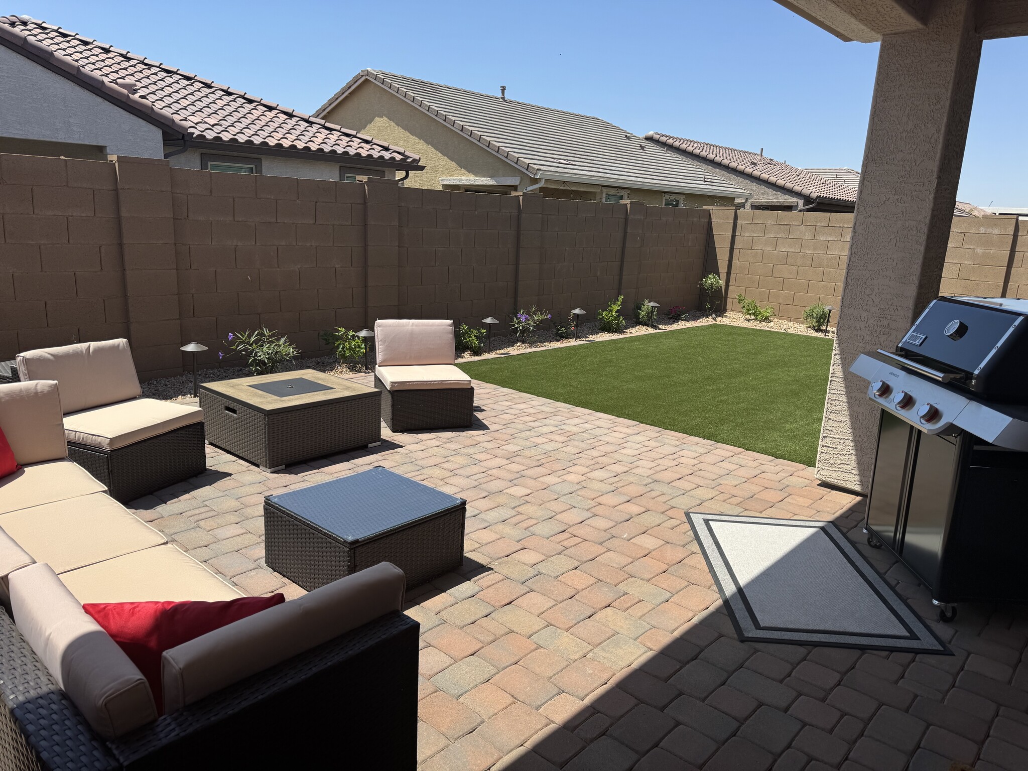 Beautiful back yard with firepit, turf, shrubs and privacy - 8957 W Palo Verde Dr
